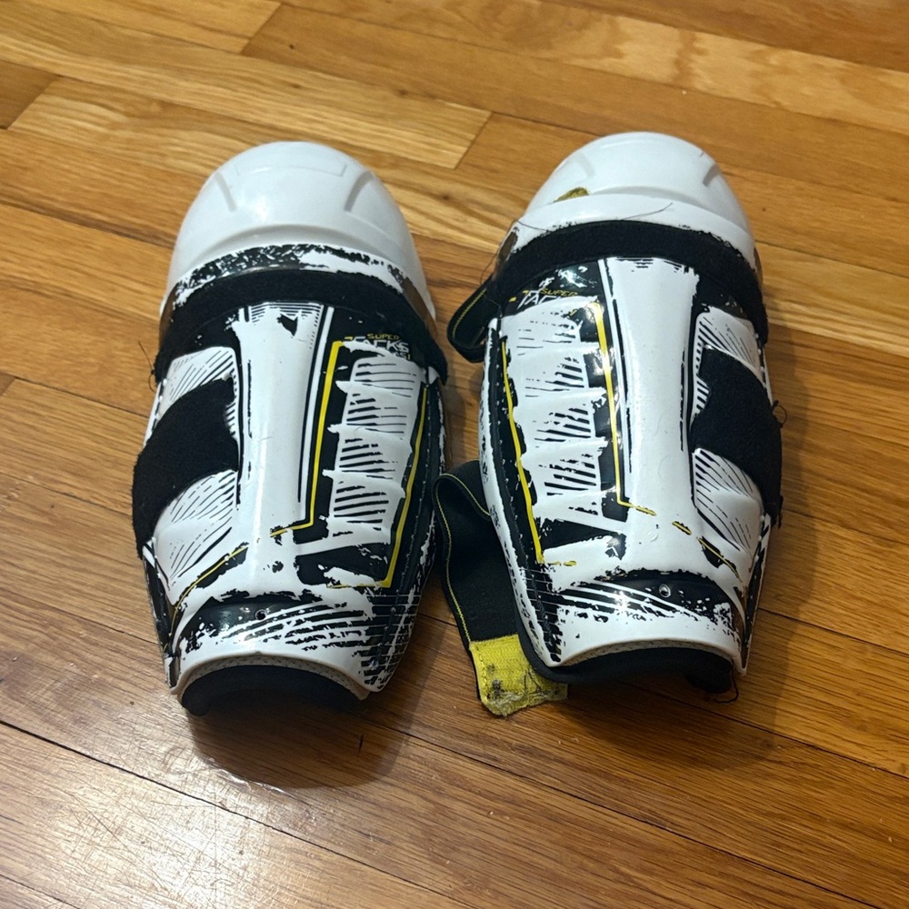 CCM Kids White and Black Sports Shoes with Yellow Accents